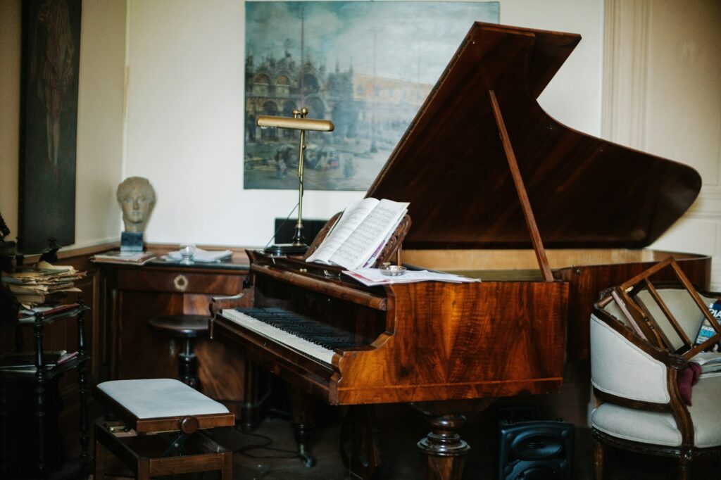 Vintage wooden Piano with a stool